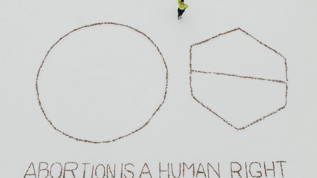 Artist Michele Pred stands with the art activation in promotion of the film Plan C, which premiered at Sundance on Monday, January 23.