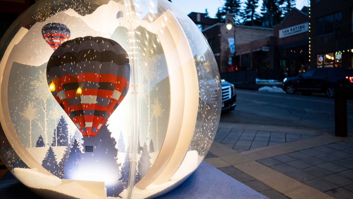 A photo of a snow globe installation as part of the Snow Globe Stroll along Historic Park City's Main Street.