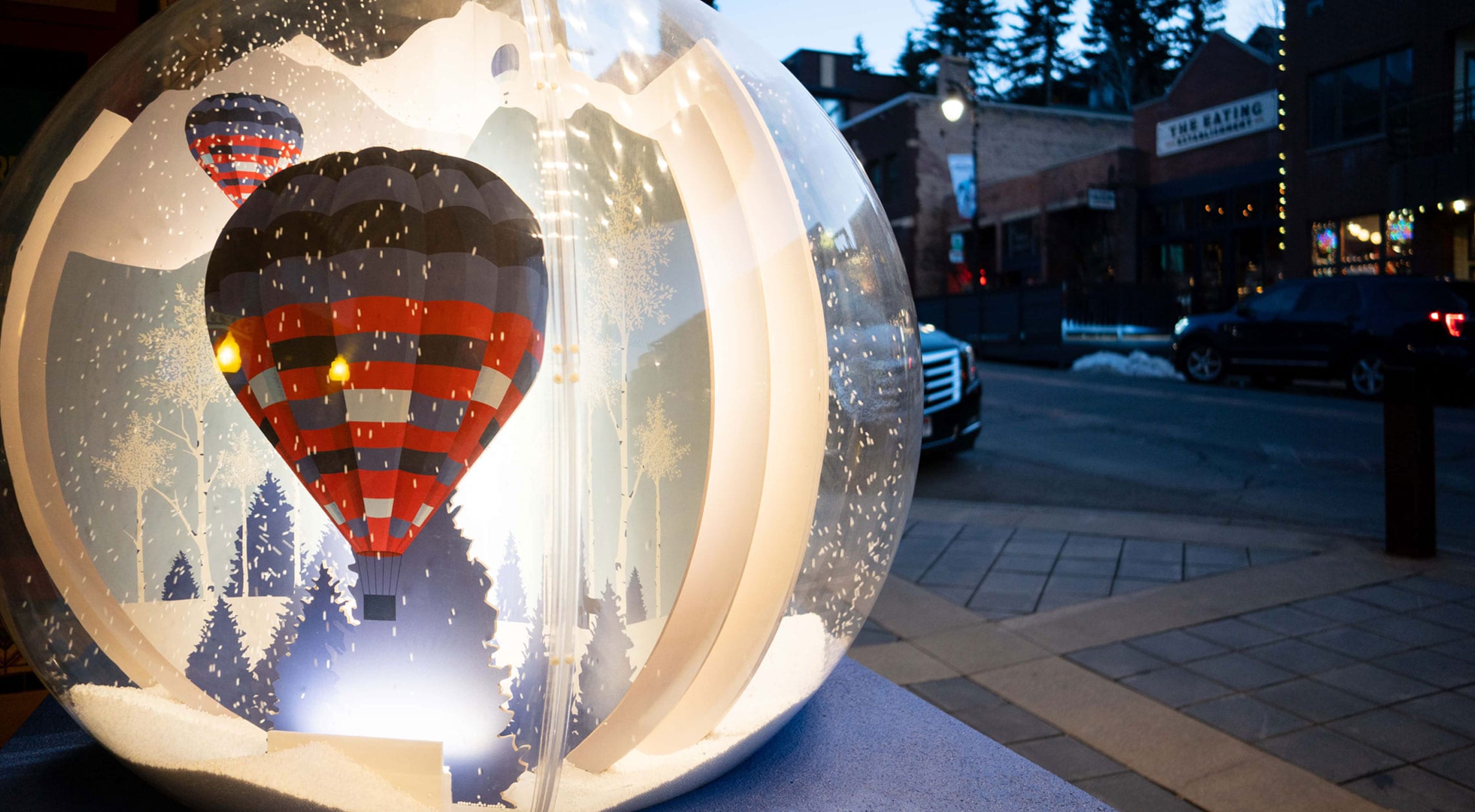 A photo of a snow globe installation as part of the Snow Globe Stroll along Historic Park City's Main Street.