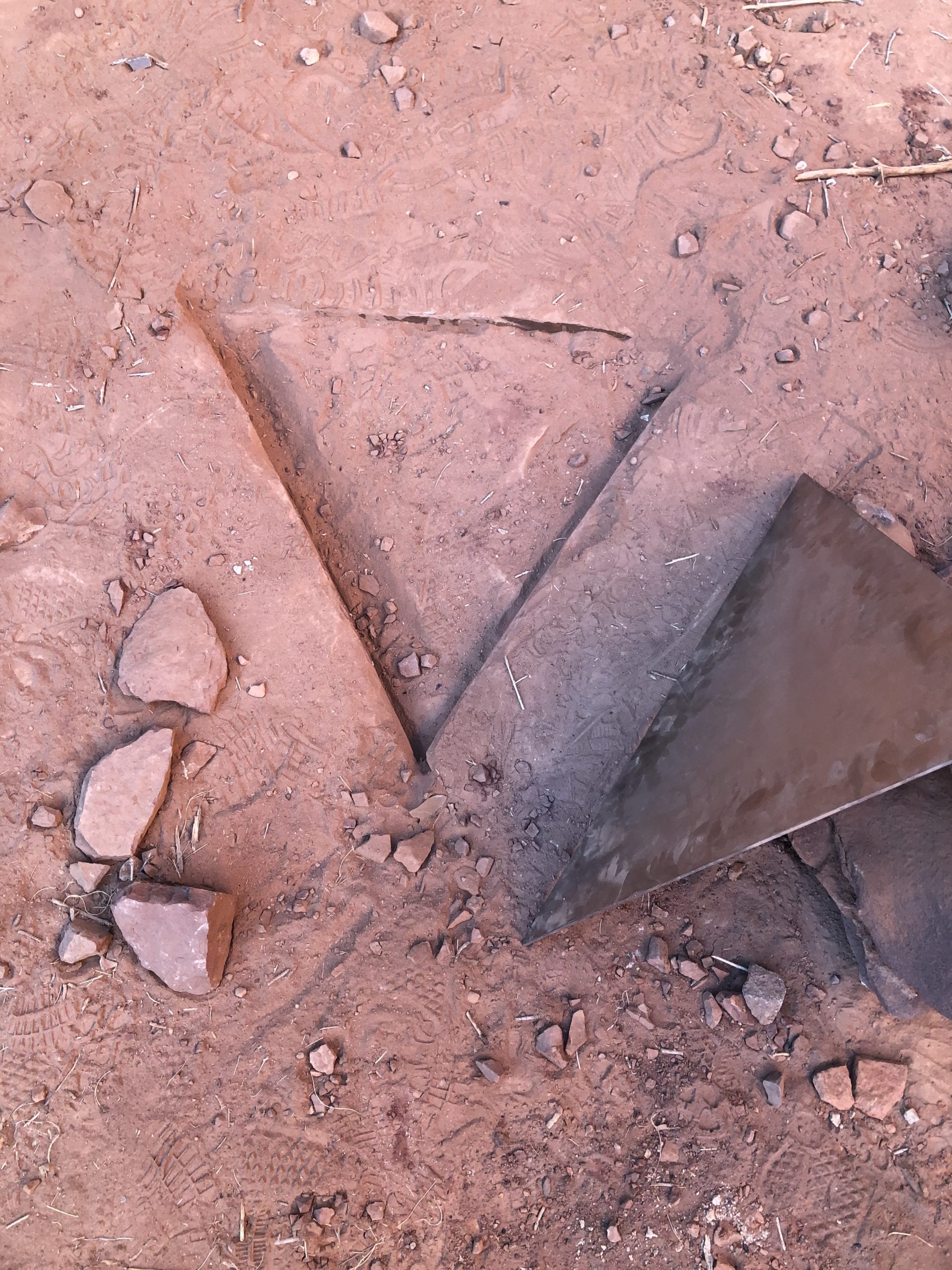 BLM Utah photo. Impression in the soil showing where the illegally installed structure known as the "monolith" had been removed.