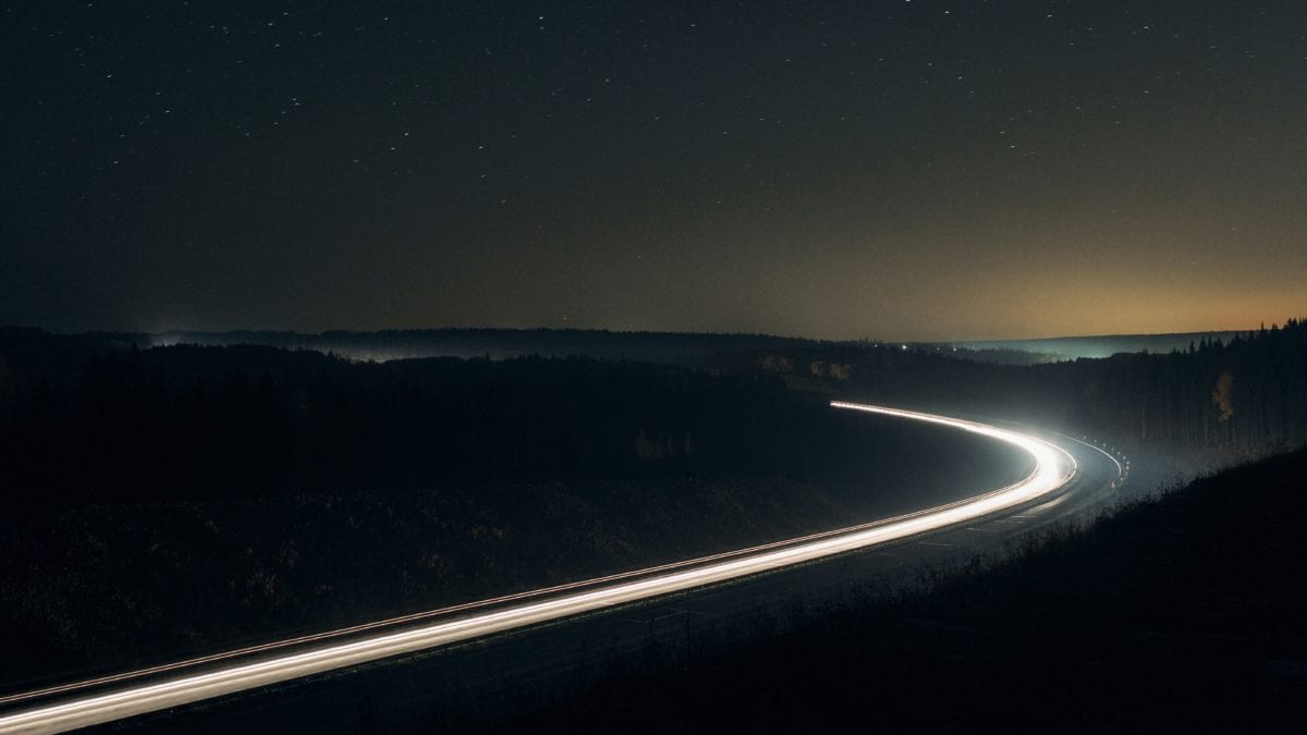 Photo of a highway at night.