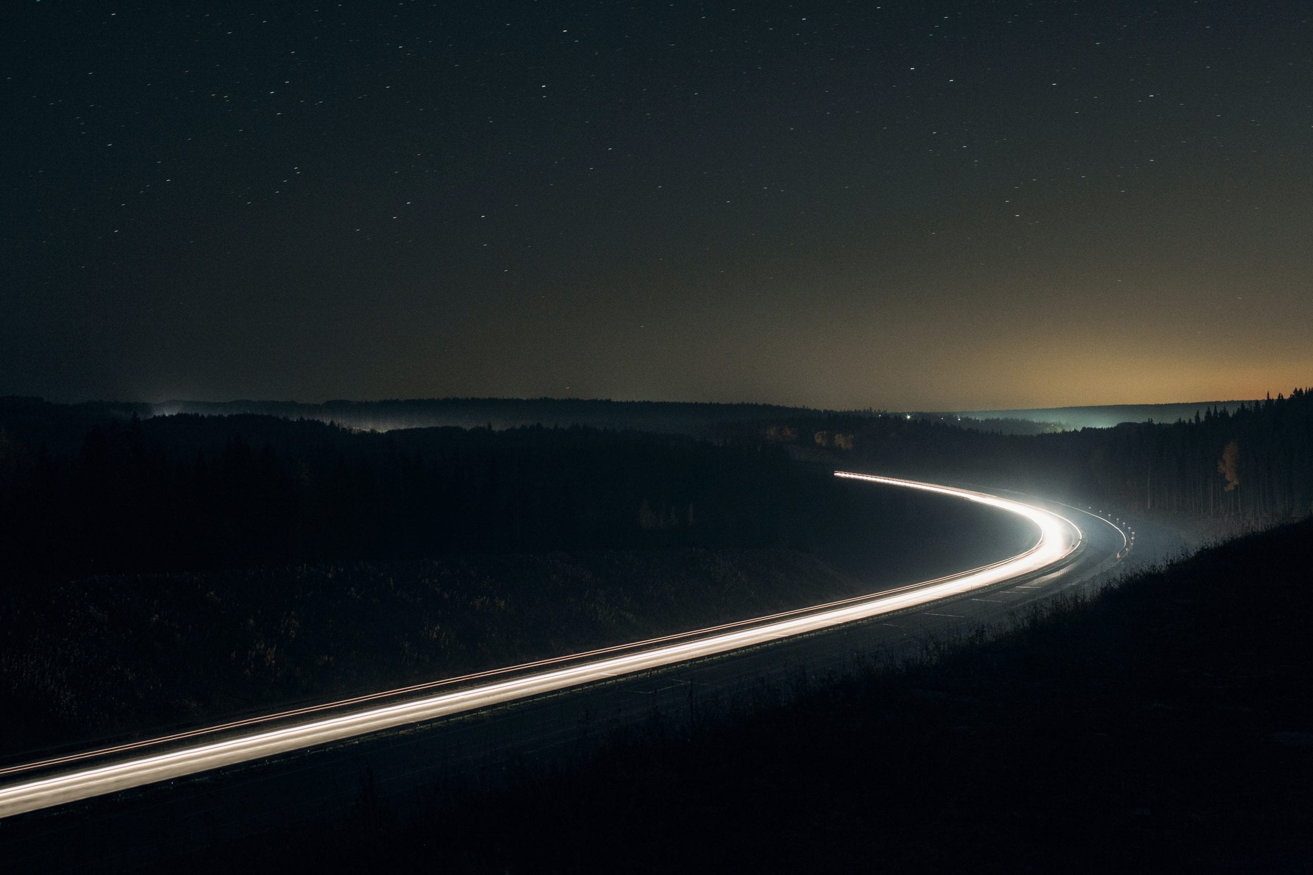 Photo of a highway at night.