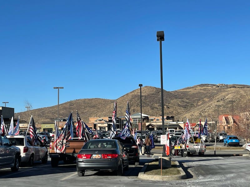 Trump supporters gather in the parking lot across from Starbucks in Kimball Junction after parading through the town of Park City on Saturday, Dec. 5, 2020.