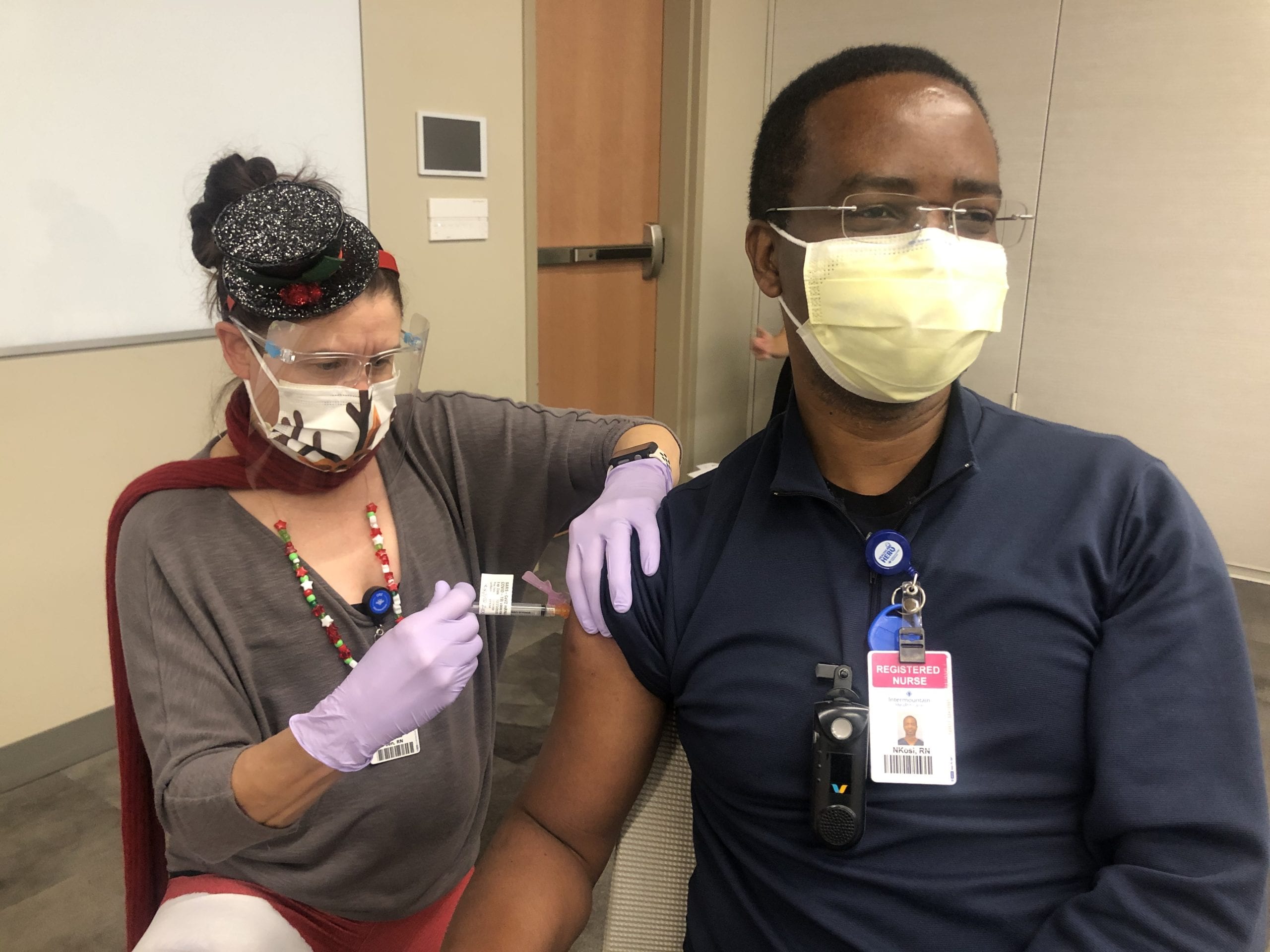 Intermountain Park City Hospital caregiver N’kosi Mlupi, RN, Med/Surg, receives his vaccine.