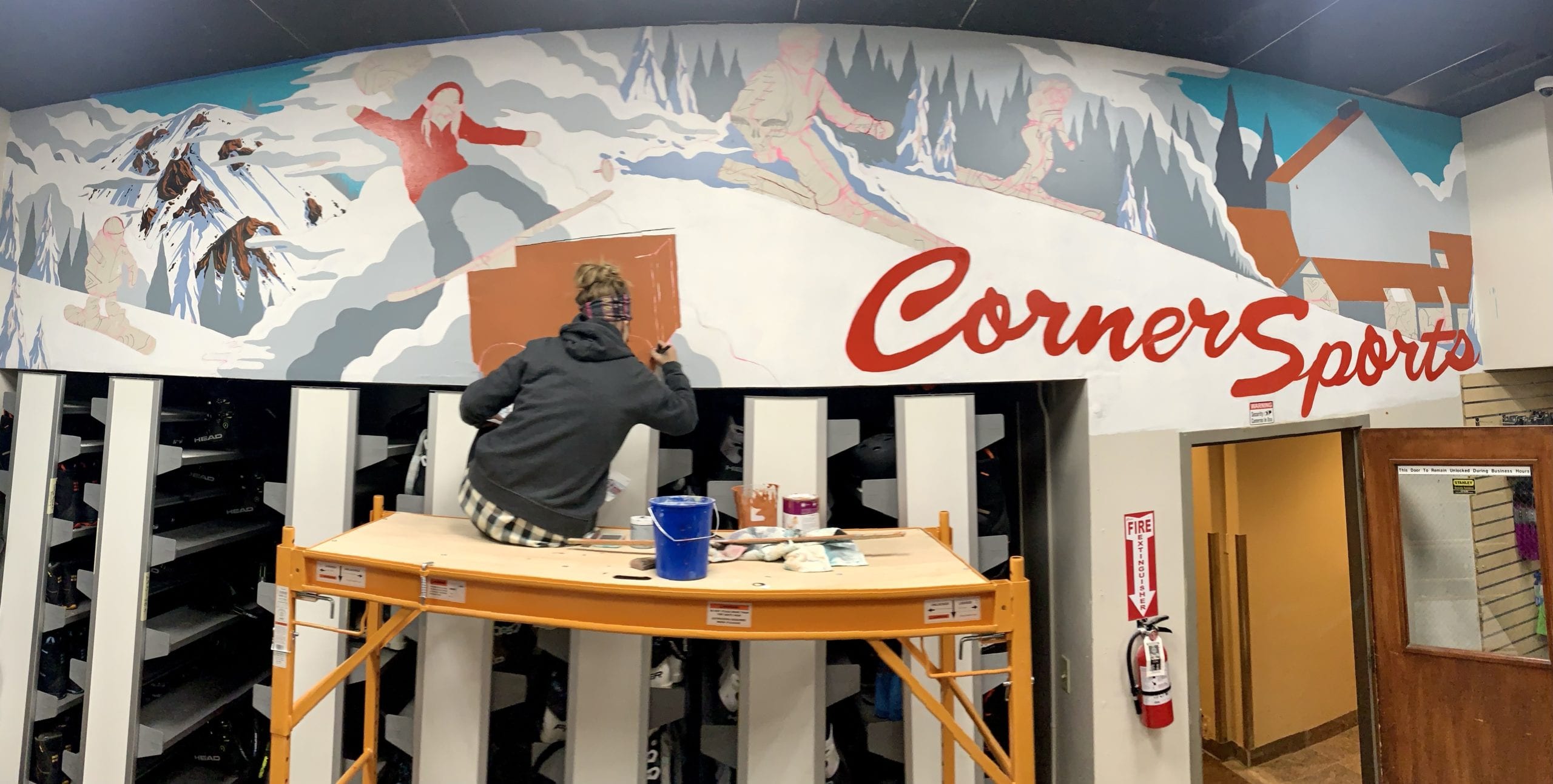 Artist AD Allegretti on a scaffold she uses to paint murals with.