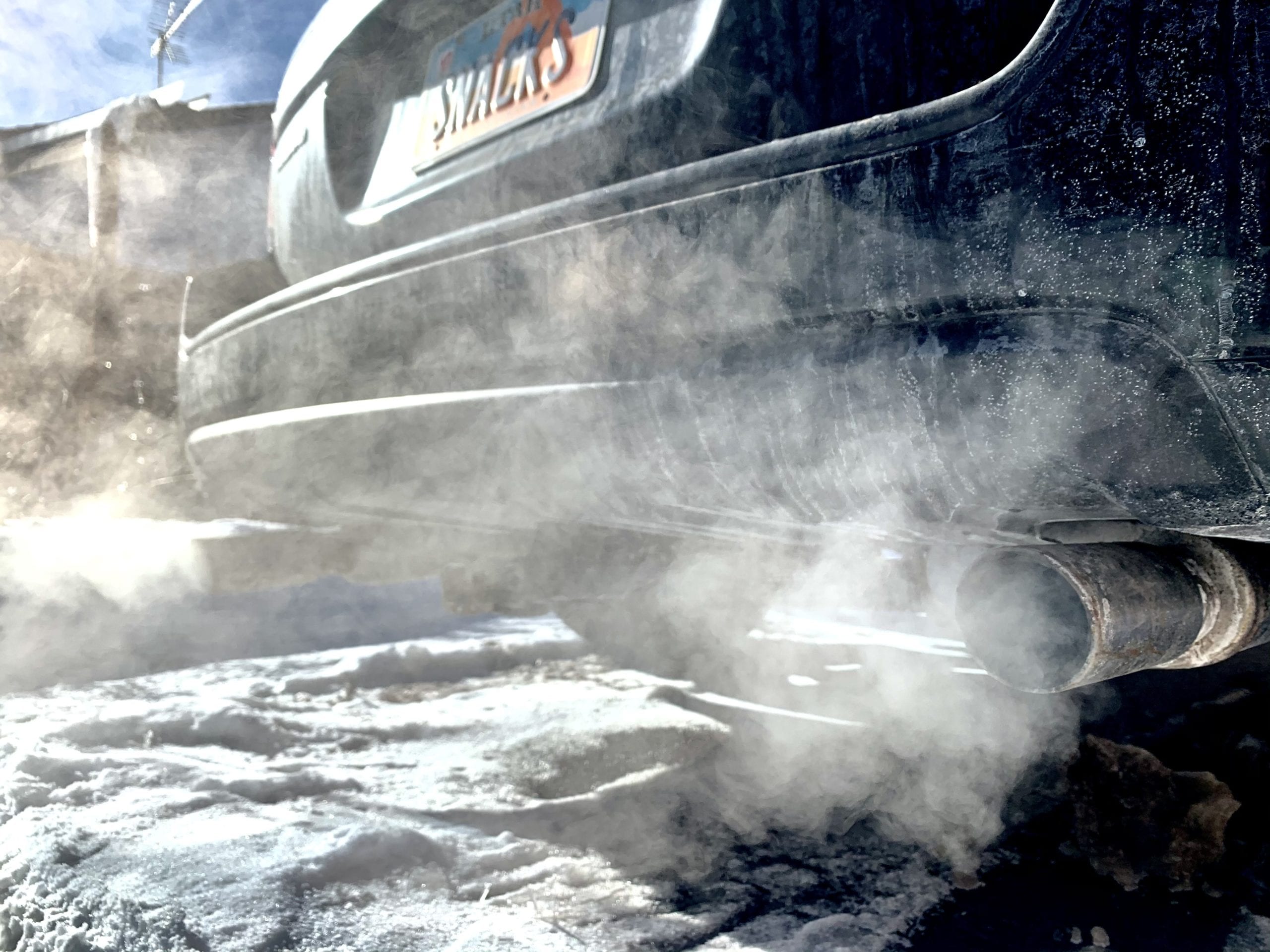 A car idling outside a building in Park City.