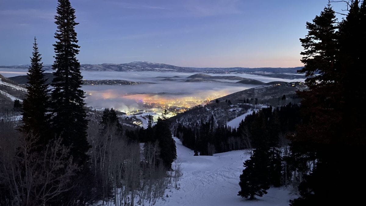 The morning light pouring out over the layer of inversion at the Park City Mountain Resort base area.