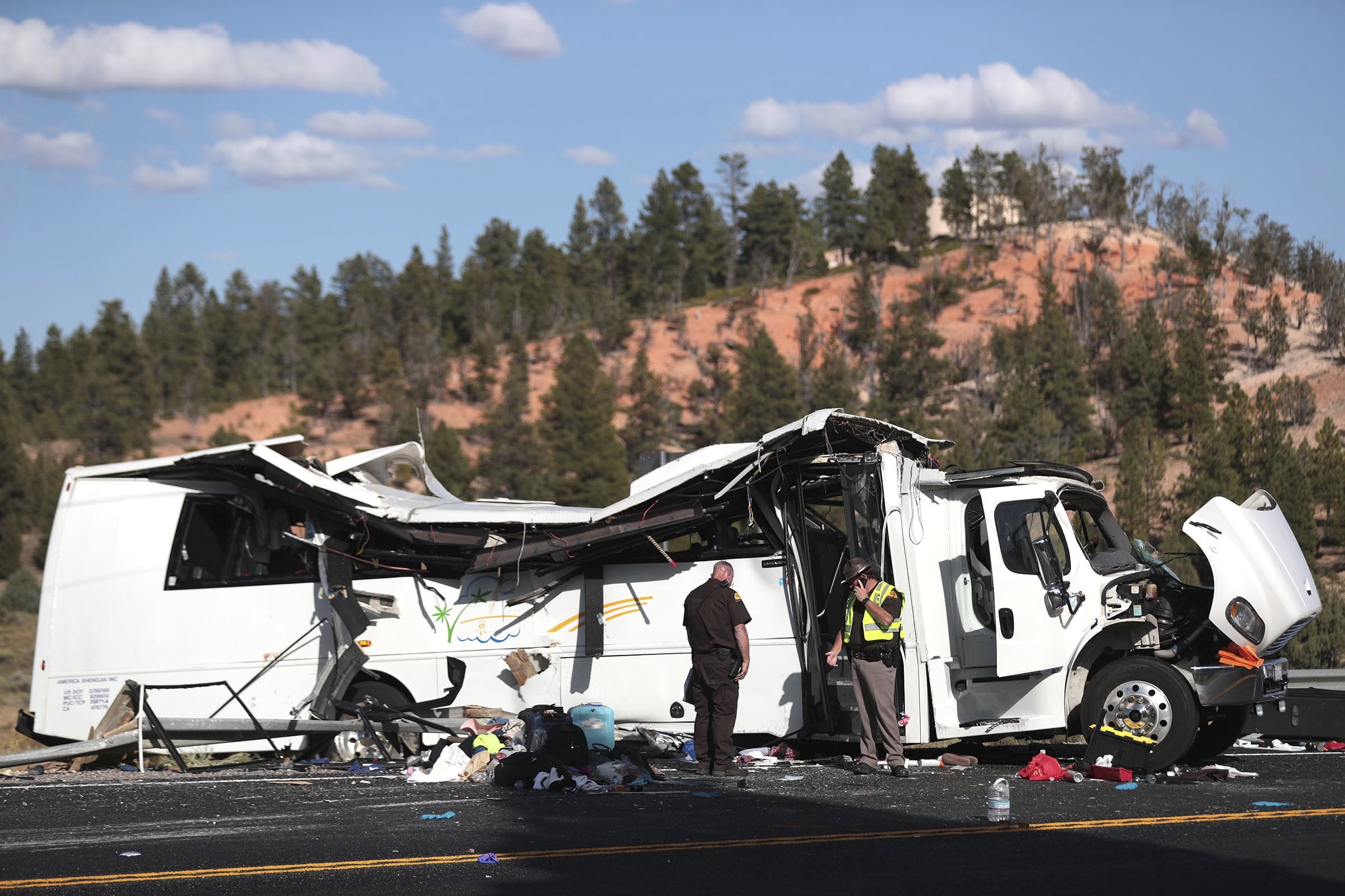 Authorities work the scene of a tour bus crash near Bryce Canyon National Park on Sept. 20, 2019, in Utah. The tour bus that crashed and killed four Chinese tourists near a national park in Utah in 2019 had problems earlier that day with the engine not starting, according to a new documents released Wednesday, March 31, 2021, by U.S. authorities investigating the incident.