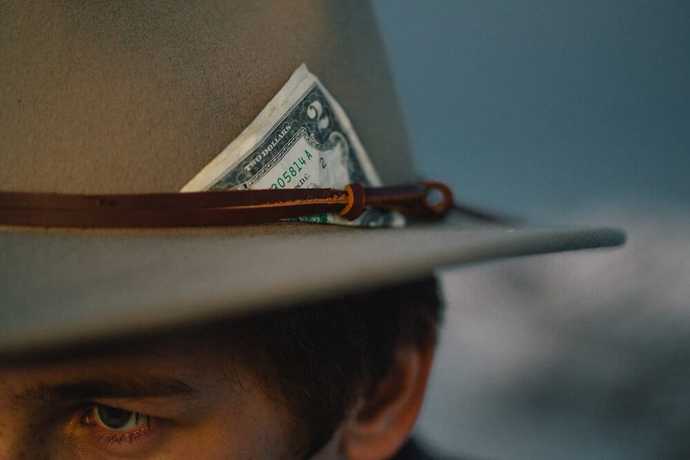 Wyatt Pike's signature Indiana Jones hat with a $2 bill.