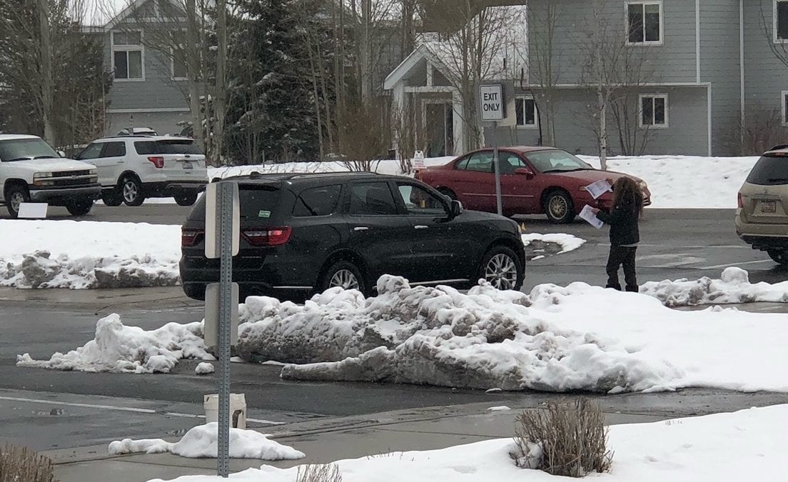 After being removed from Park City High School, parents distributed anti-vaccine flyers to passing cars.