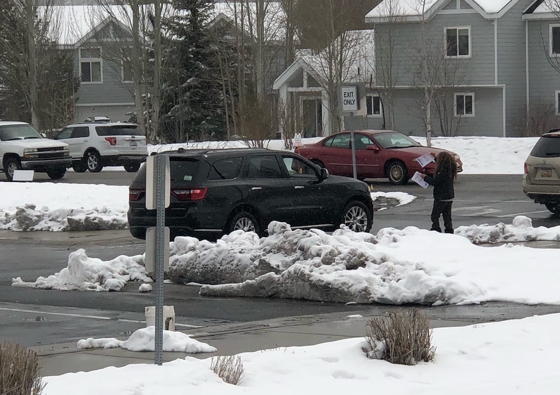 After being removed from Park City High School, parents distributed anti-vaccine flyers to passing cars.