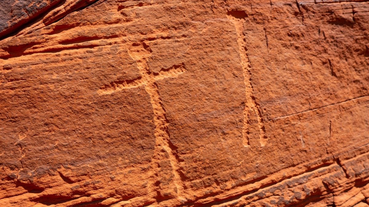 A wall with petroglyphs in Moab was bolted for sport climbing routes.