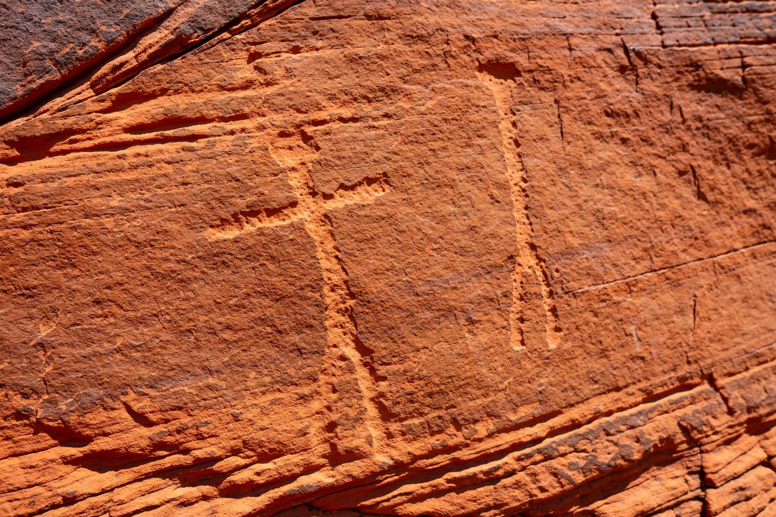 A wall with petroglyphs in Moab was bolted for sport climbing routes.