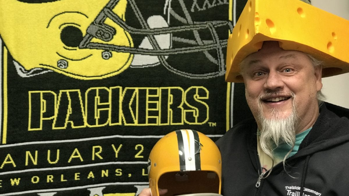 Mr. Meier with his signature cheese-head lucky hat, like the one he wore in his official school picture day photo year after year.