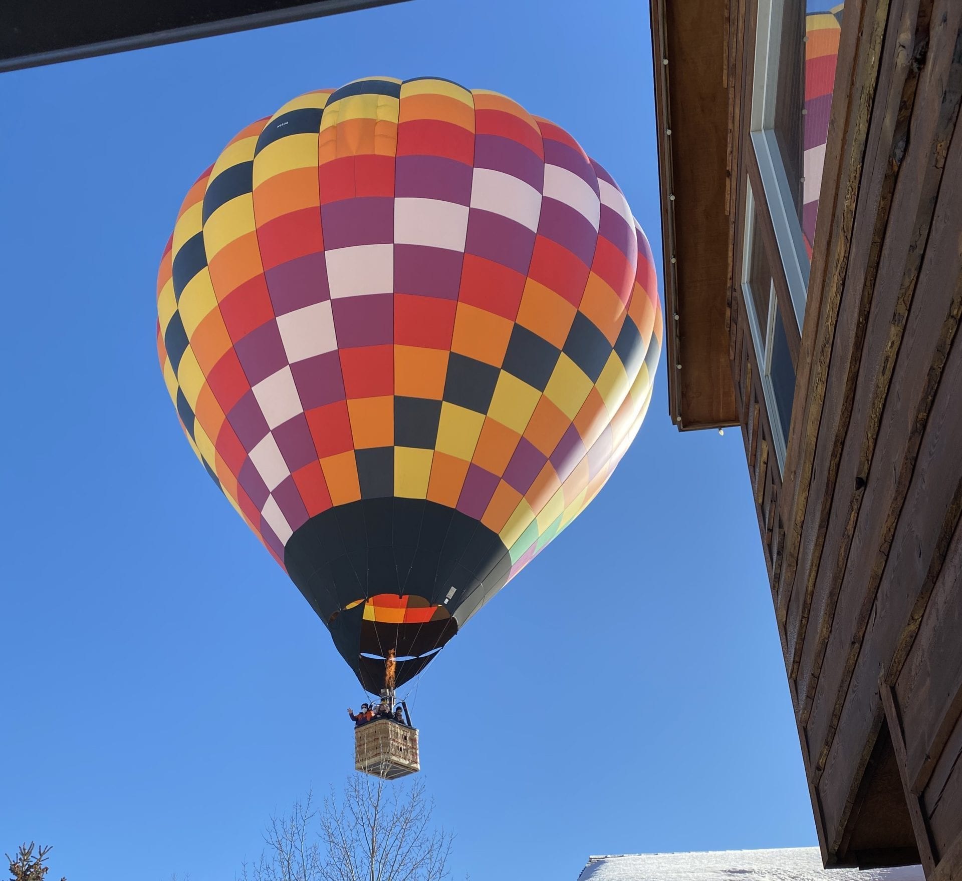 A colorful balloon hovers over Park City.