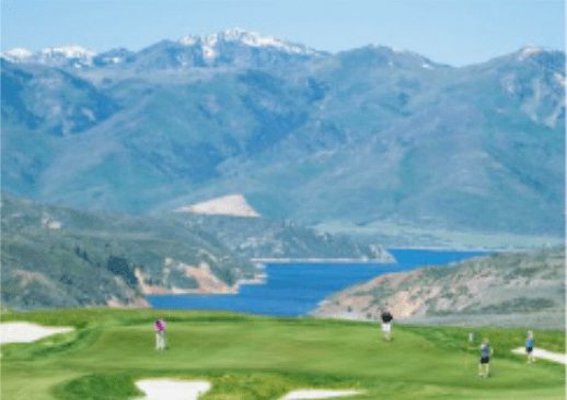 Victory Ranch Golf Course in Francis, Utah with Deer Valley Resort in the background and Jordanelle Reservoir in the foreground. Youth Sports Alliance is holding a golf tournament there which is open to the public for participation.