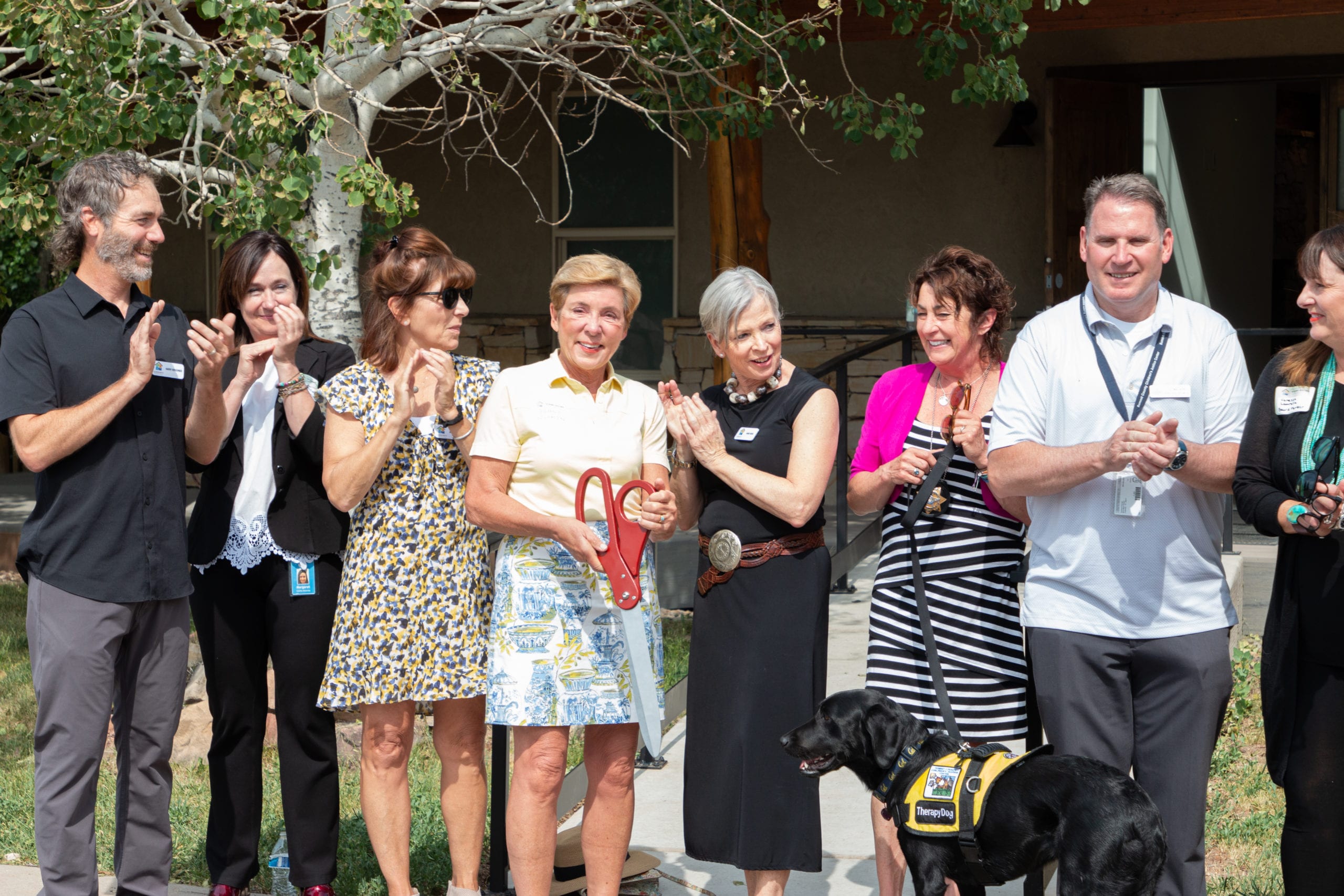 Kallie, the therapy dog is joined by all of the important humans that helped to launch the new Children's Justice Center in Park City.