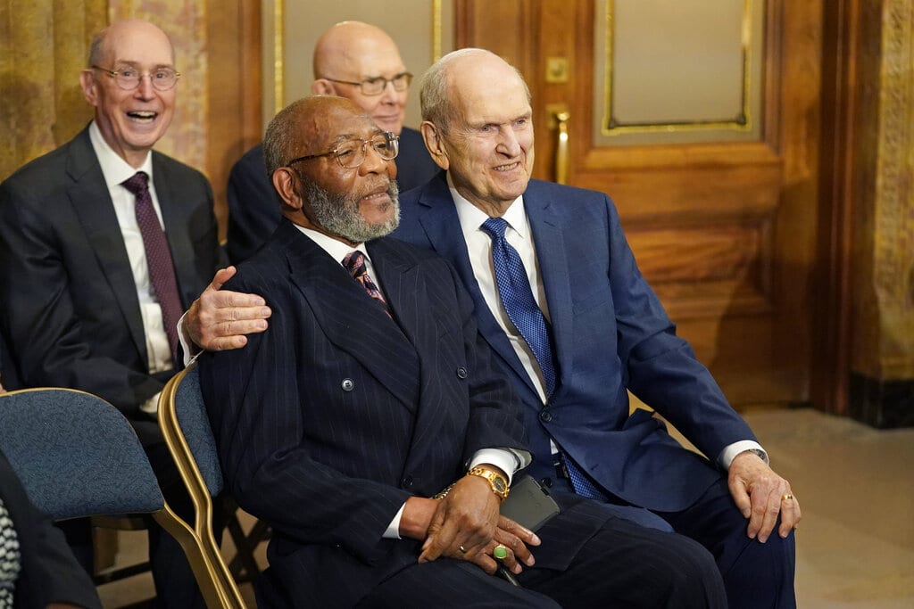 The Rev. Amos C. Brown, front left, and President Russell M. Nelson of The Church of Jesus Christ of Latter-day Saints are shown during a news conference Monday, June 14, 2021, in Salt Lake City. Top leaders from the NAACP and The Church of Jesus Christ of Latter-day Saints announced $9.25 million in new educational and humanitarian projects as they seek to build on an alliance formed in 2018.