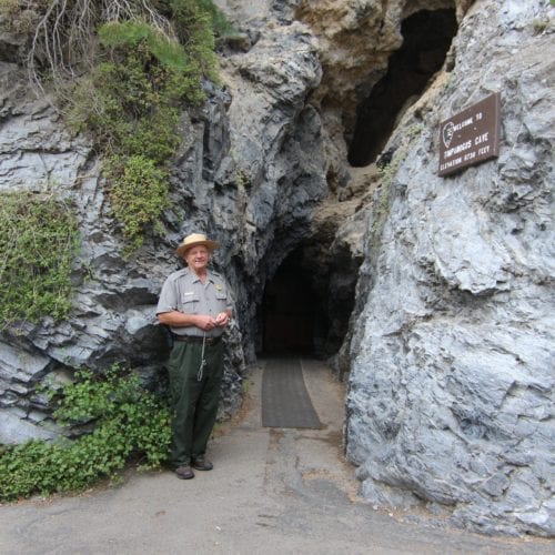 Timpanogos Cave National Monument Ranger Jay Allen stands at the cave entrance in 2019, in American Fork, Utah.