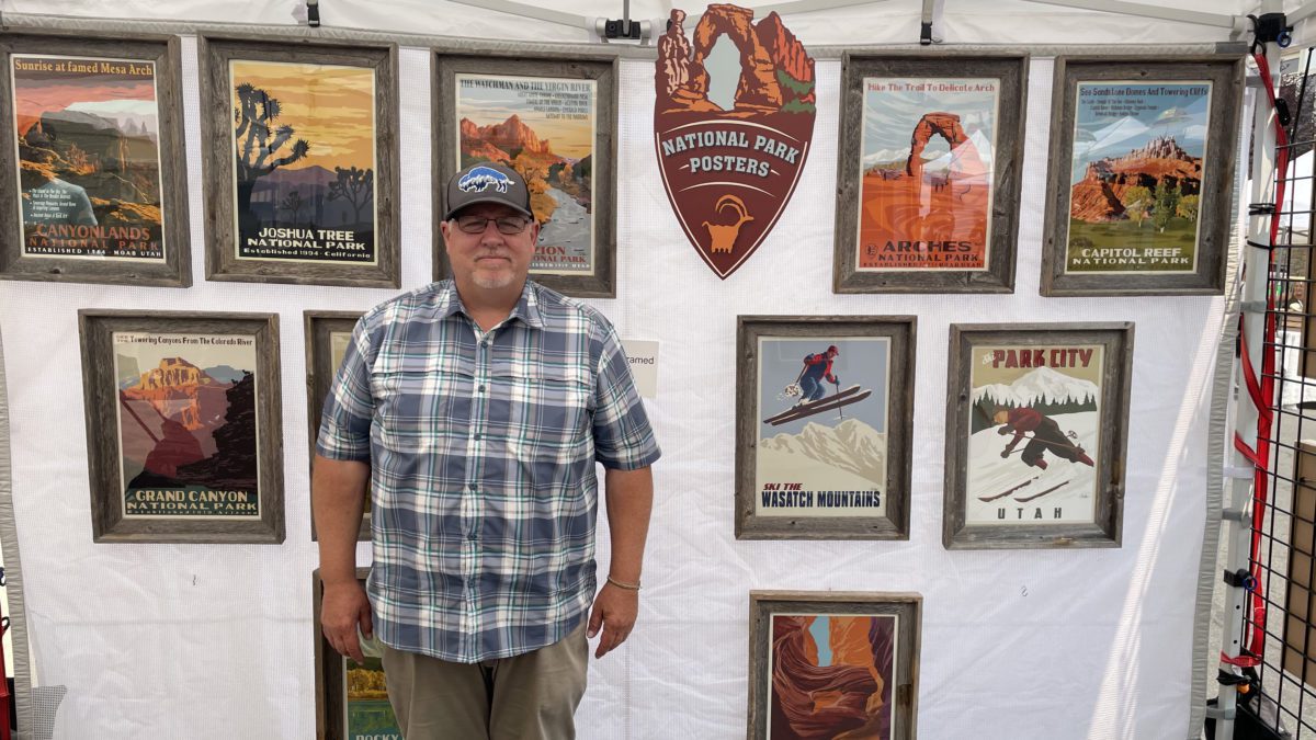 C.D. Cross stands inside his tent at the Park Silly Sunday Market.