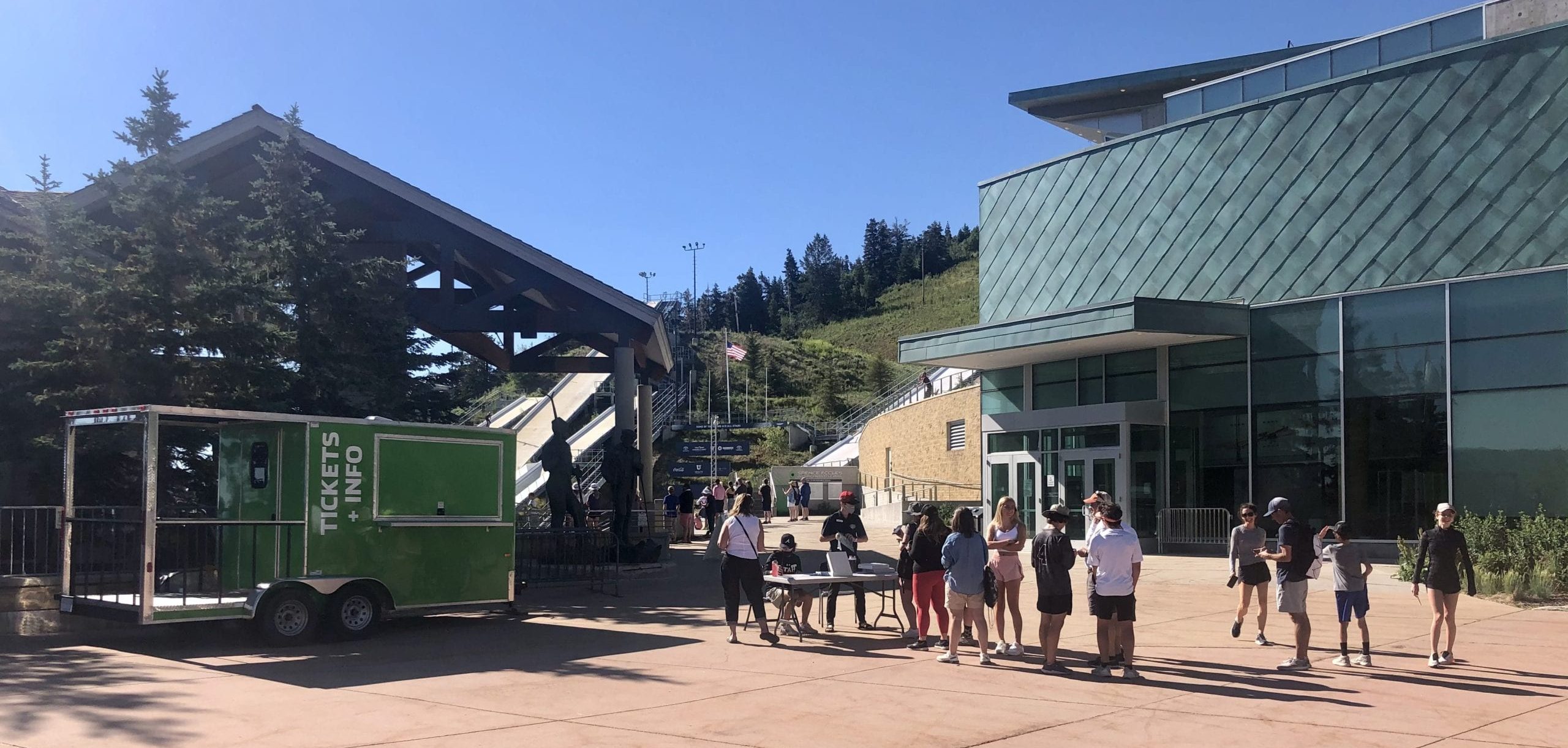 2018 Olympian Casey Larson (red cap answering guest questions behind the information desk) is working at the Utah Olympic Park when he's not training at the Utah Olympic Park, or perhaps it's the other way around. Illinois' Larson just won the ski jumping national championships on Sunday.