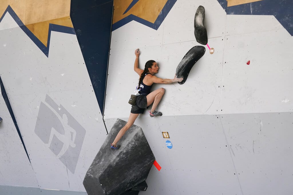 United States' Kyra Condie climbs during women's boulder qualifications at the climbing World Cup in Salt Lake City, in this May 21, 2021, file photo. Condie was told she needed back surgery to fix a severe curvature in her spine and would never be able to climb again. She did have surgery, after getting a second opinion, and has willed herself into becoming one of the world’s elite climbers despite having 10 vertebrae fused together.