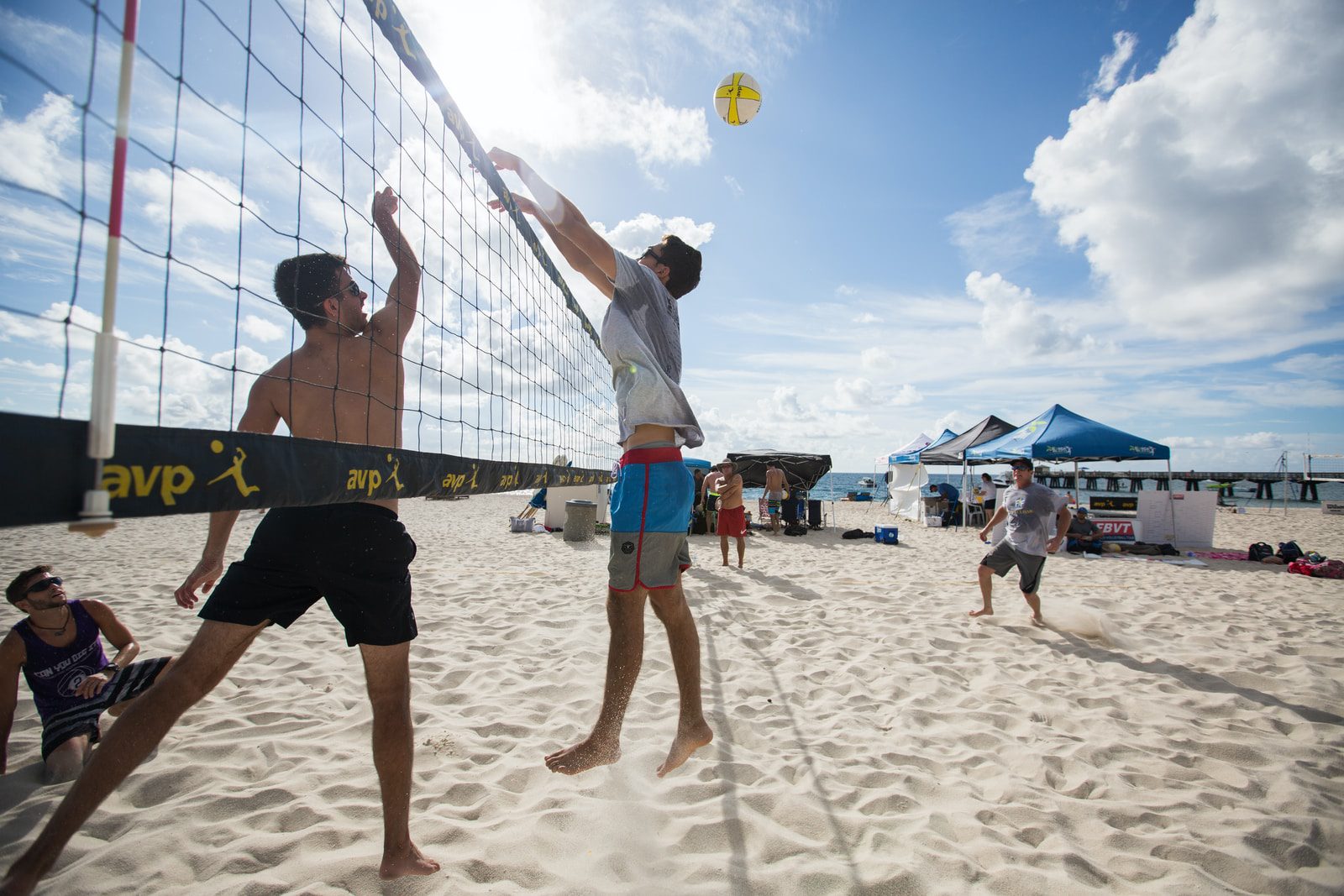 Men's beach volleyball match match-up.