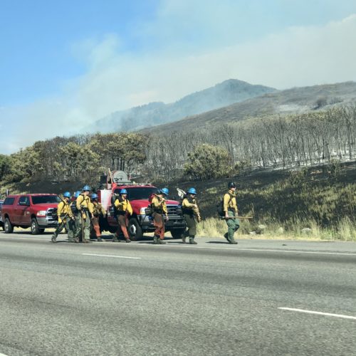 One of multiple crews hiking up the rough terrain to fight the Parley's Canyon fire on Saturday.