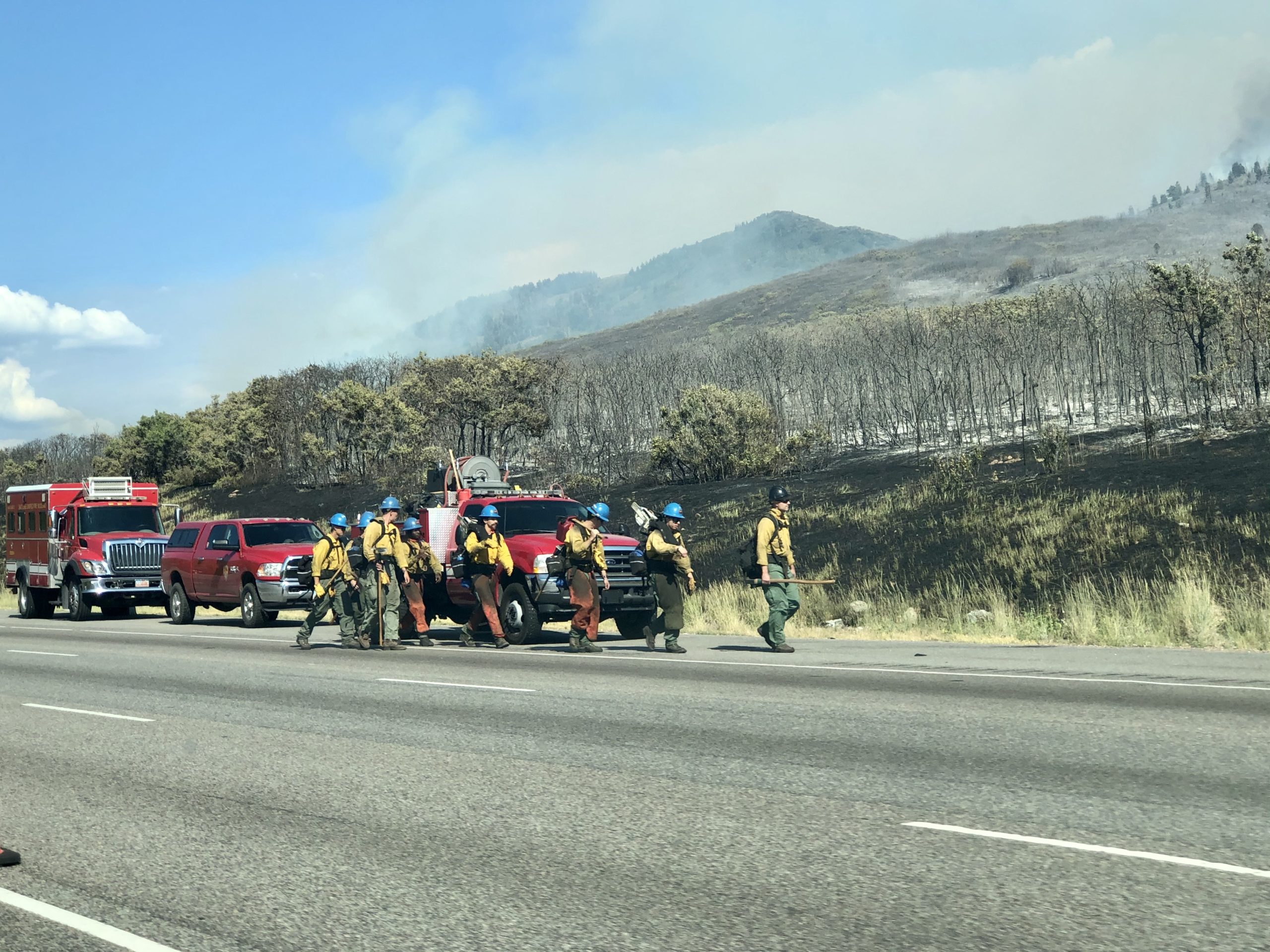 One of multiple crews hiking up the rough terrain to fight the Parley's Canyon fire on Saturday.