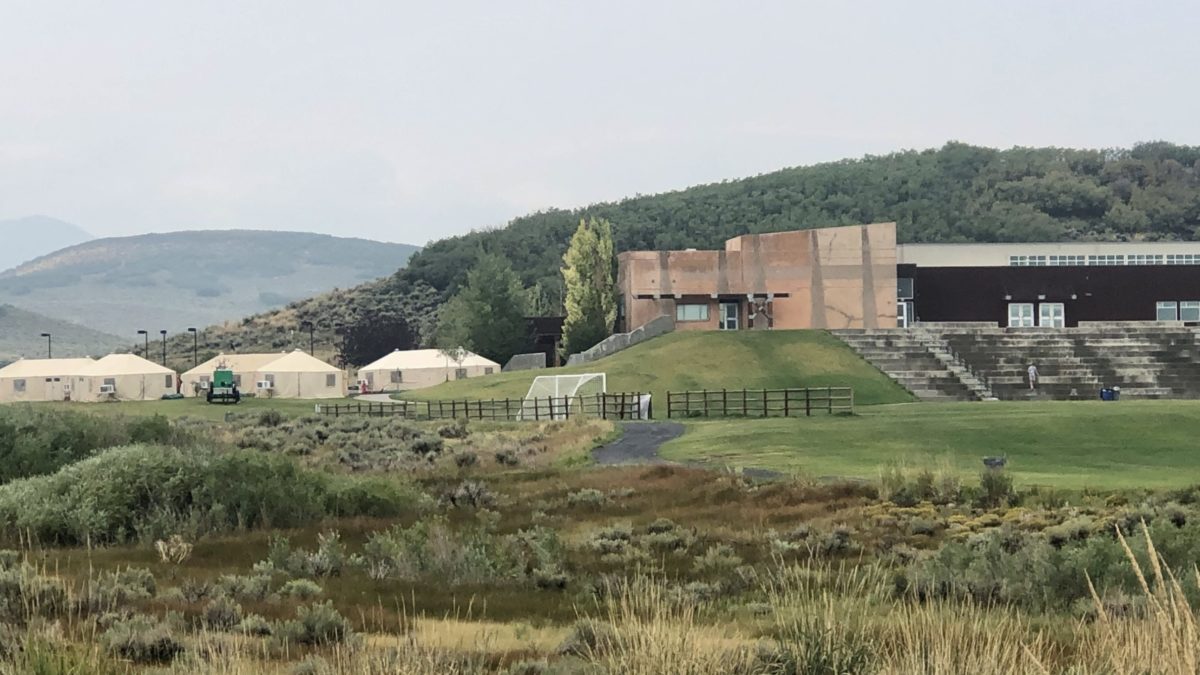 Big beige tents set up in the parking lot of the Park City Ice Arena for firefighters of the Parley's Canyon Fire.