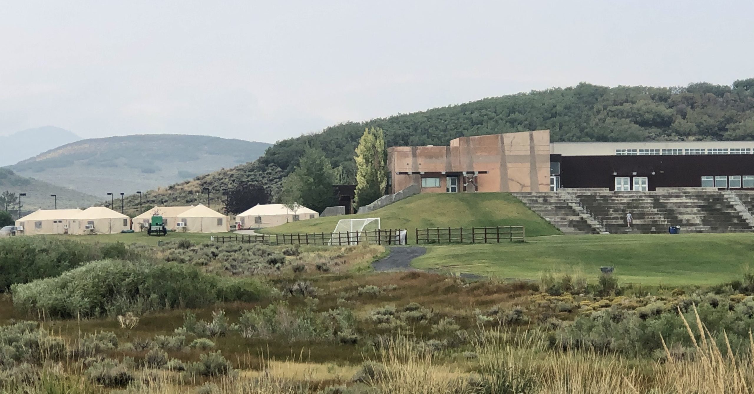 Big beige tents set up in the parking lot of the Park City Ice Arena for firefighters of the Parley's Canyon Fire.