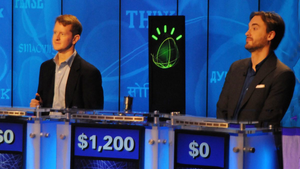 Ken Jennings (left) playing against IBM's Watson (center).