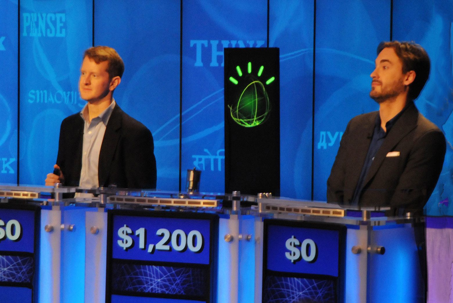 Ken Jennings (left) playing against IBM's Watson (center).