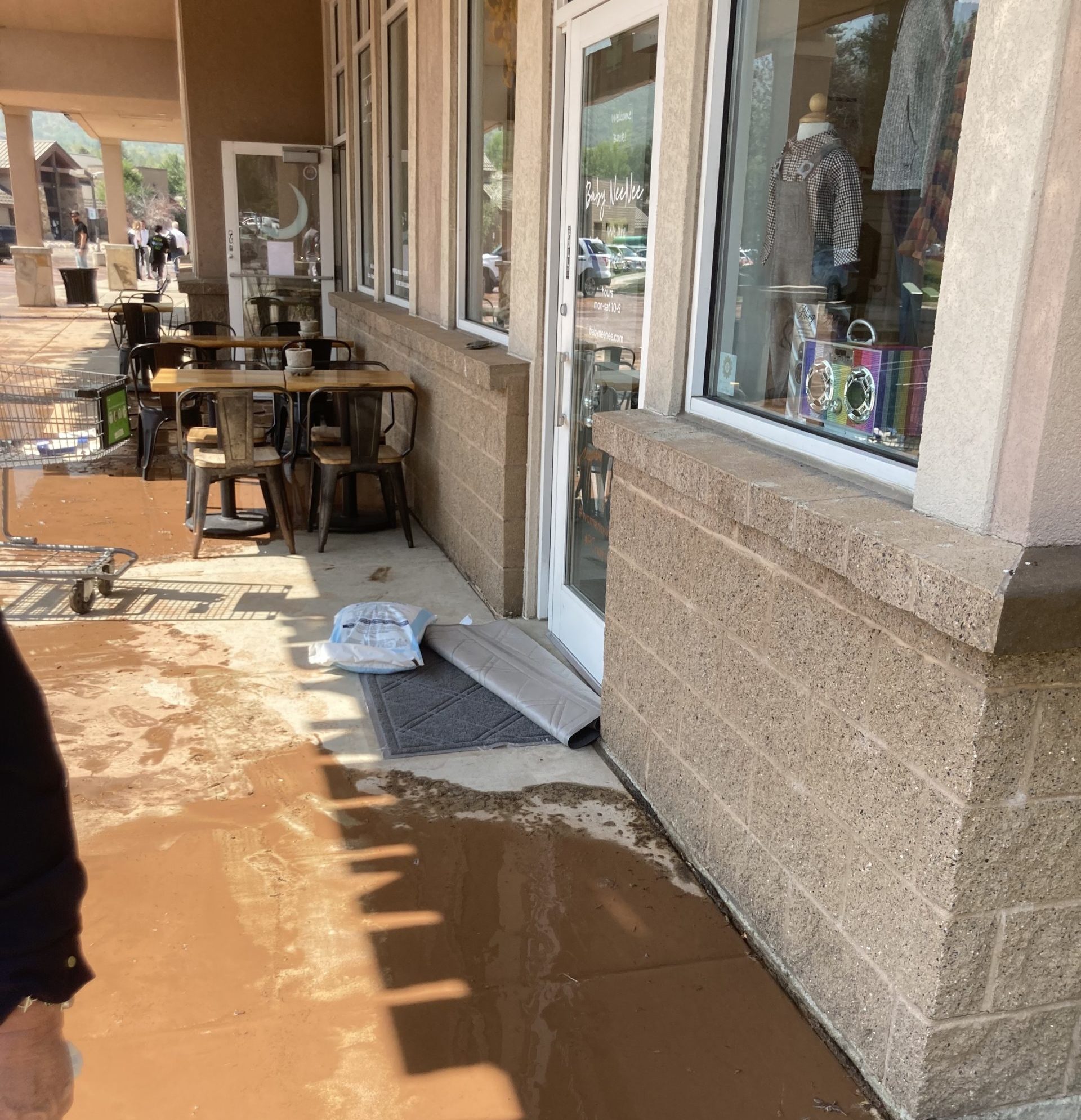 Flooding outside of Baby NeeNee in Snow Creek Plaza.