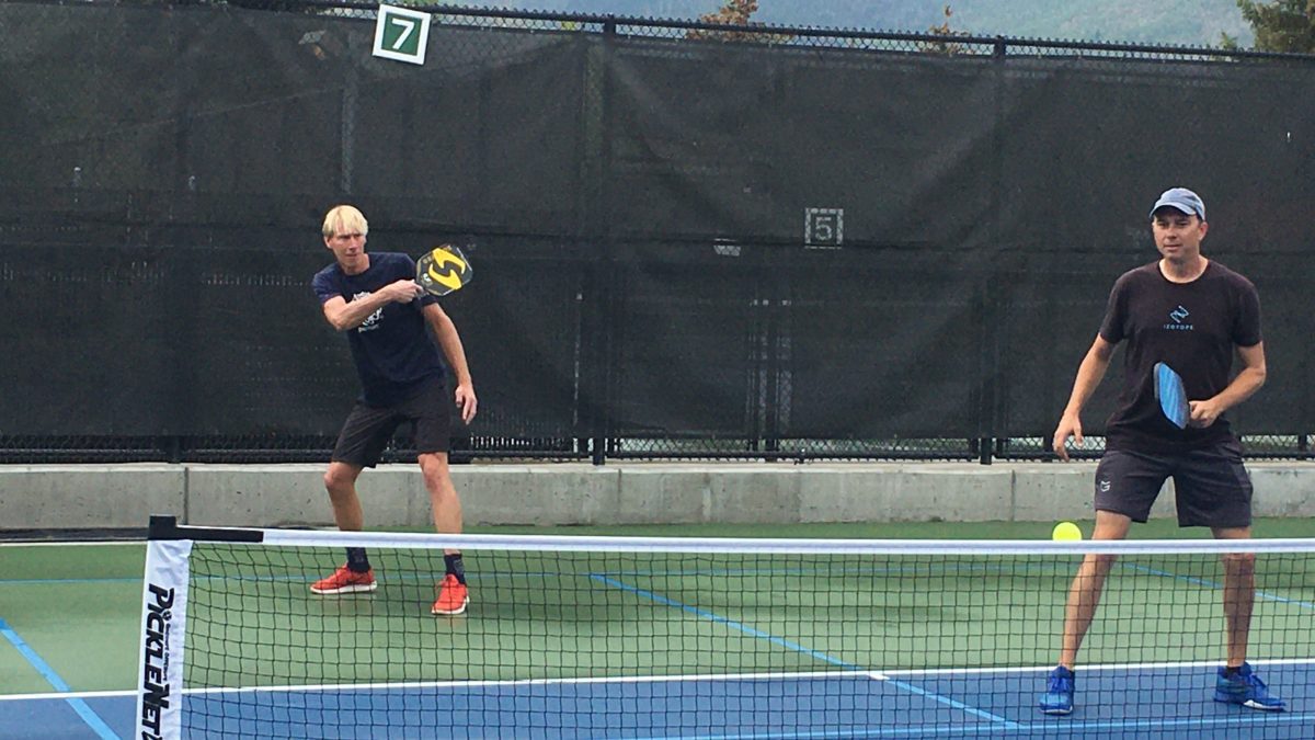 Mayor Andy Beerman (left) and local musician Jody Whitesides battle it out on the court at the Park City Pickleball Club's Marathon event.