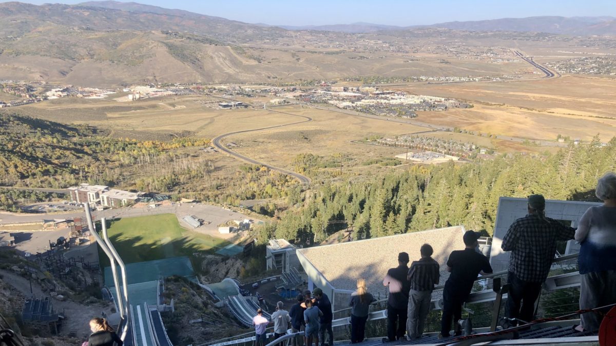 Friends and family of Chuck Heckert spreading his ashes at his beloved nordic ski jump.