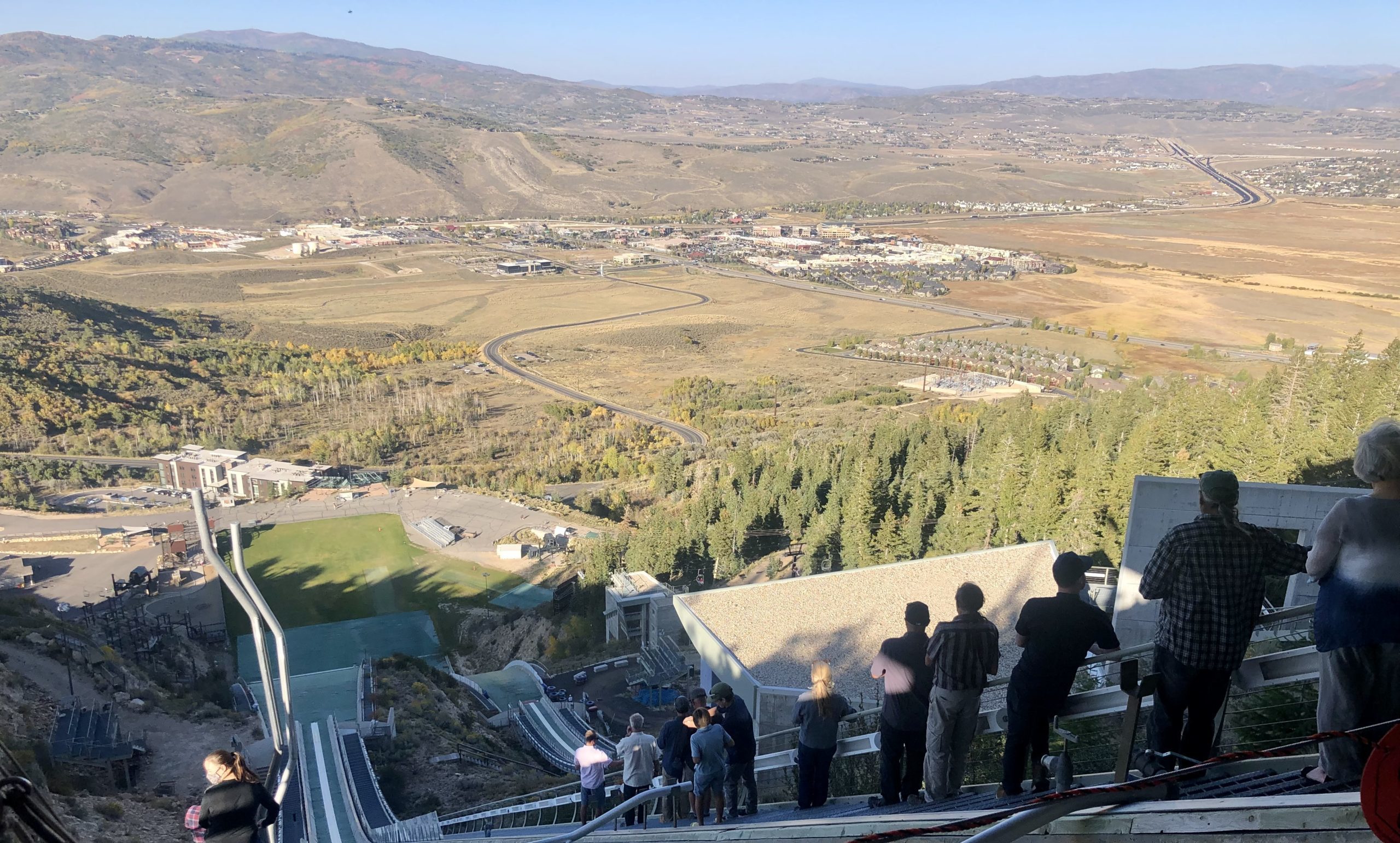 Friends and family of Chuck Heckert spreading his ashes at his beloved nordic ski jump.