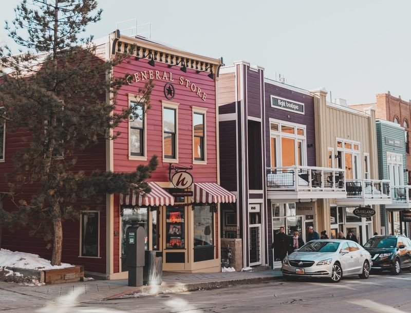 cars parked in front of store front