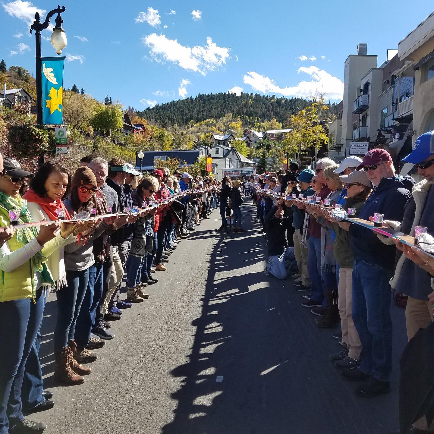 Shot Ski participants line Park City’s Historic Main Street in 2019 to throw one back.