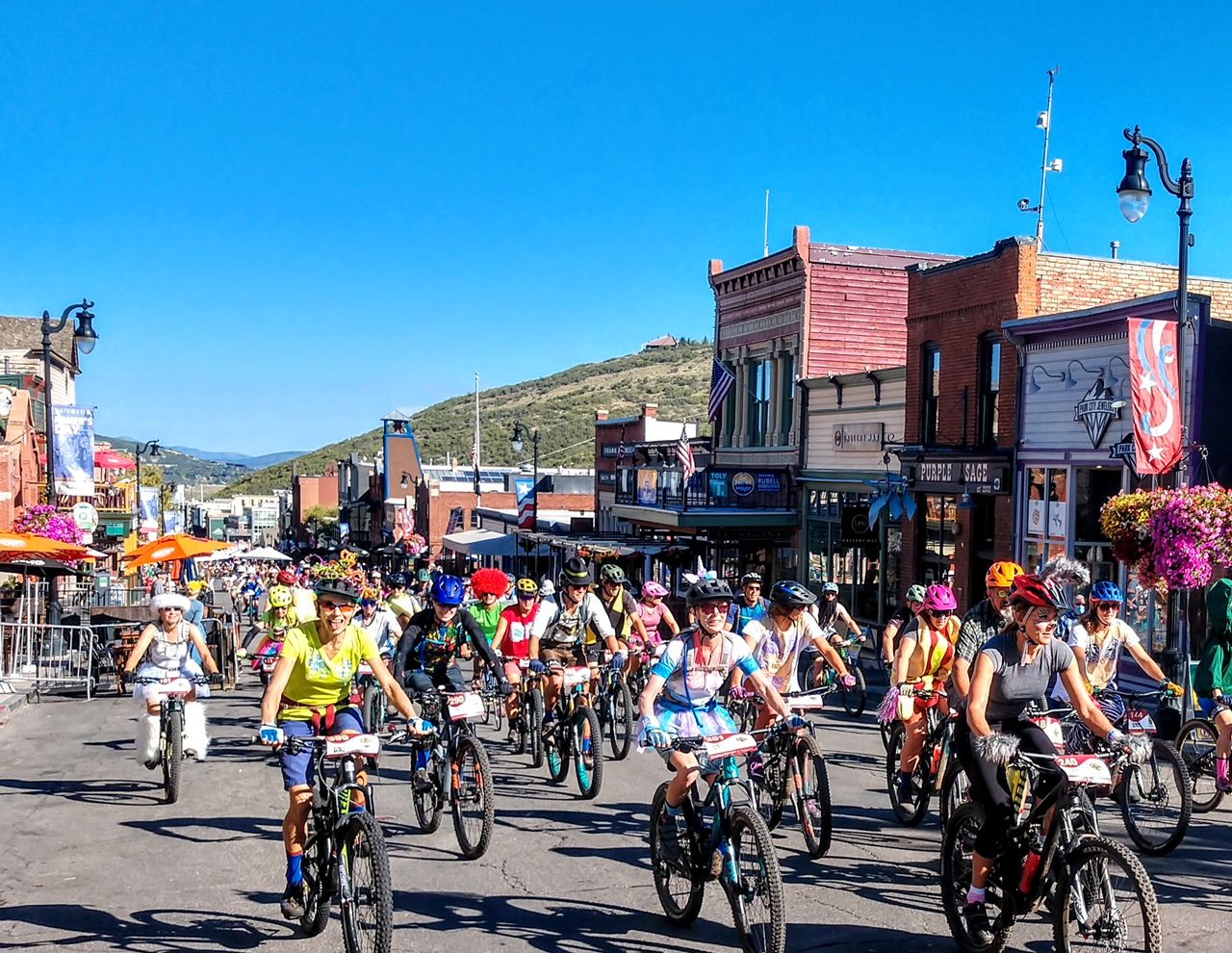 Tour des Suds participants on Main Street.