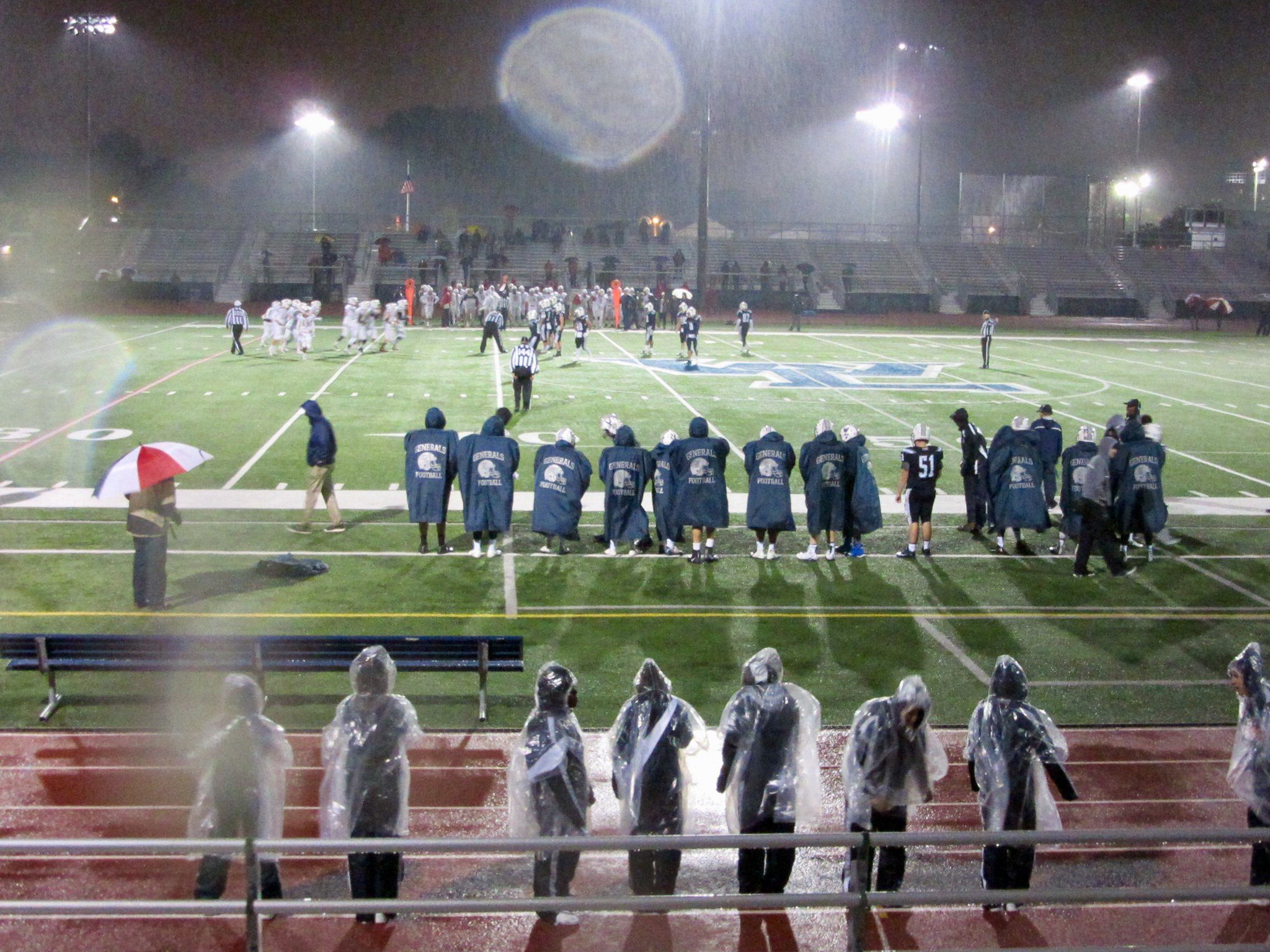 Friday night lights and Friday night rain.