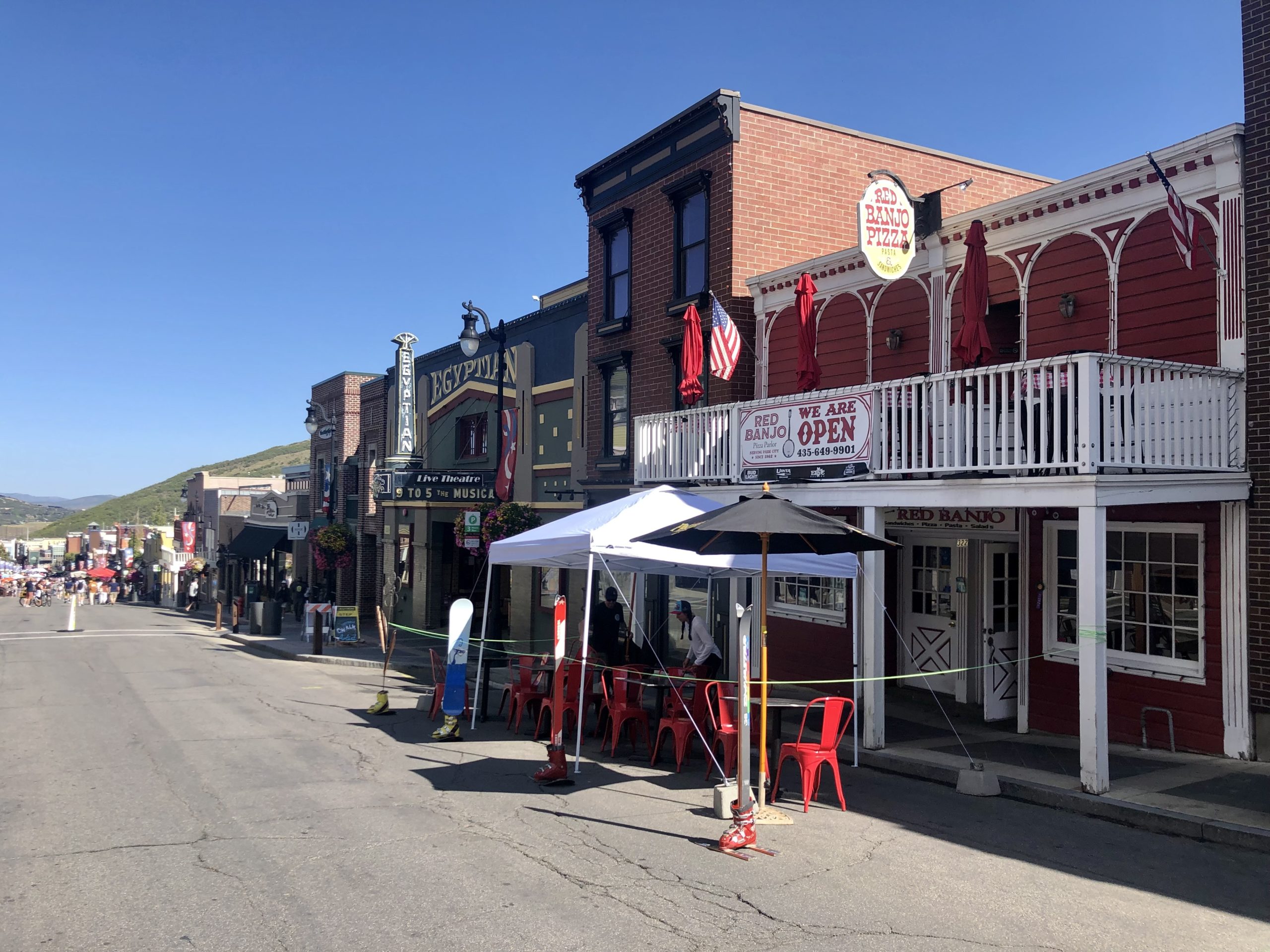 Historic main Street Park City's Red Banjo Pizza with Tana Toly setting the tables.