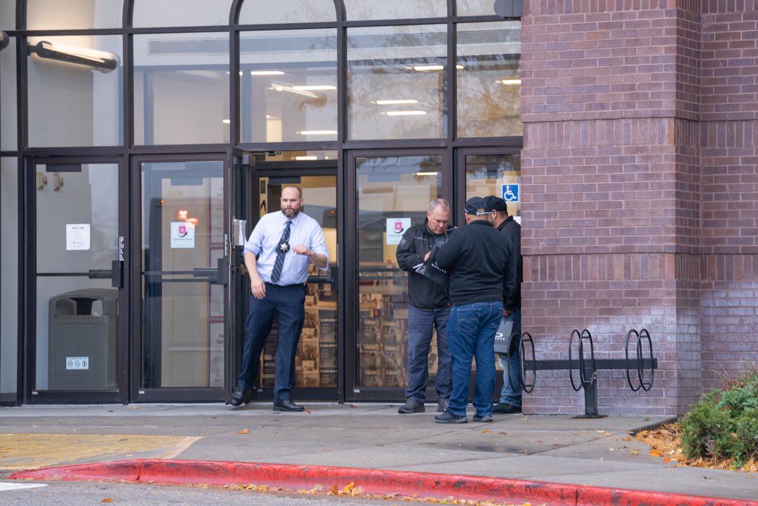 Police speak with potential witnesses outside of a mall in Boise, Idaho following a shooting.