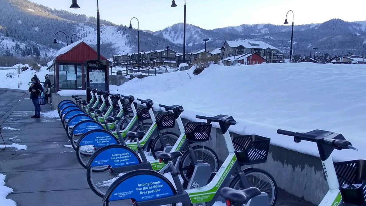 A snowy Bike Share station in Canyons Village.