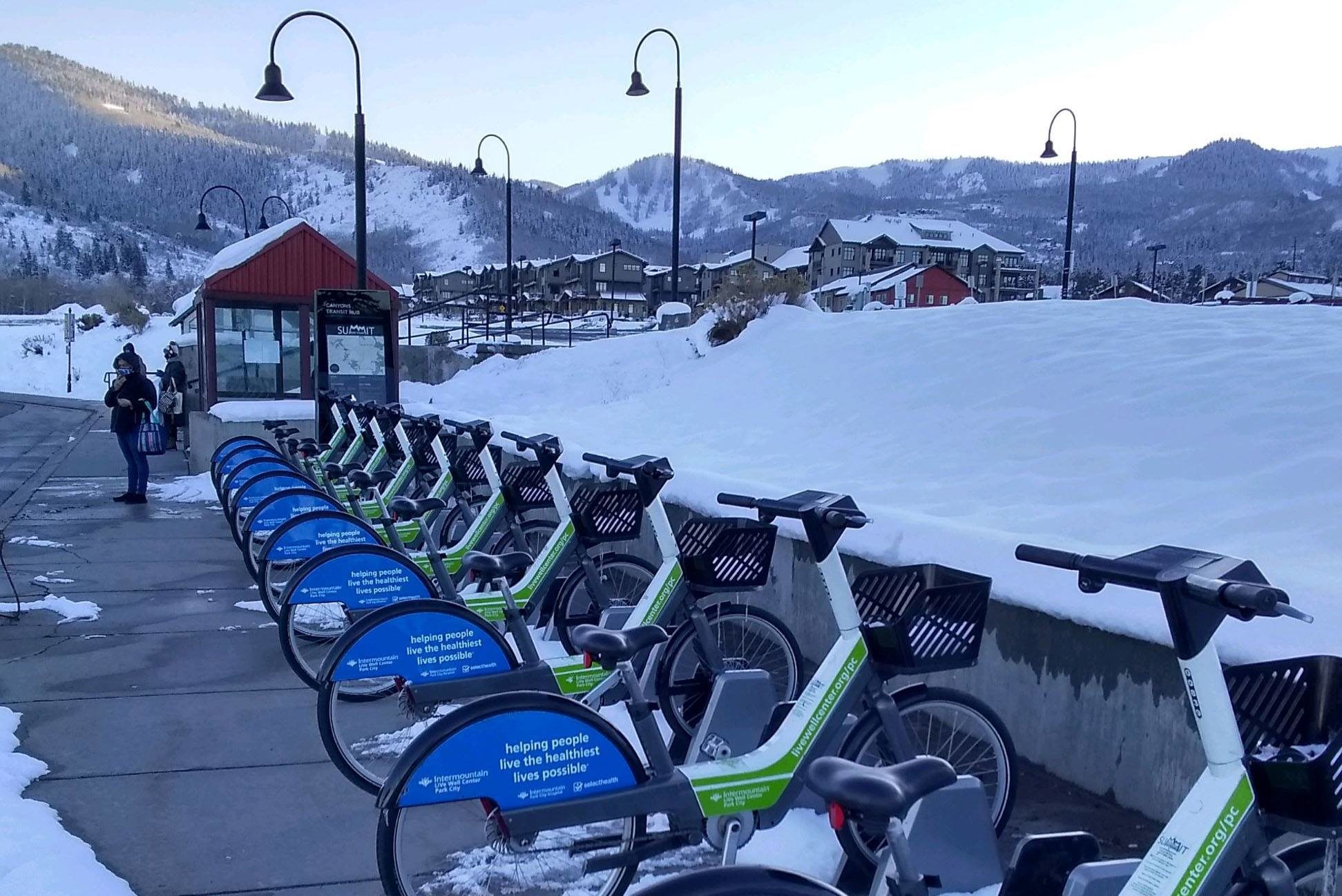 A snowy Bike Share station in Canyons Village.