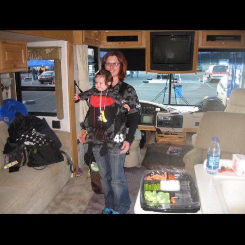 Lucy Block with her daughter, Lia, on the Rally race tour bus of her husband, Ken Block.