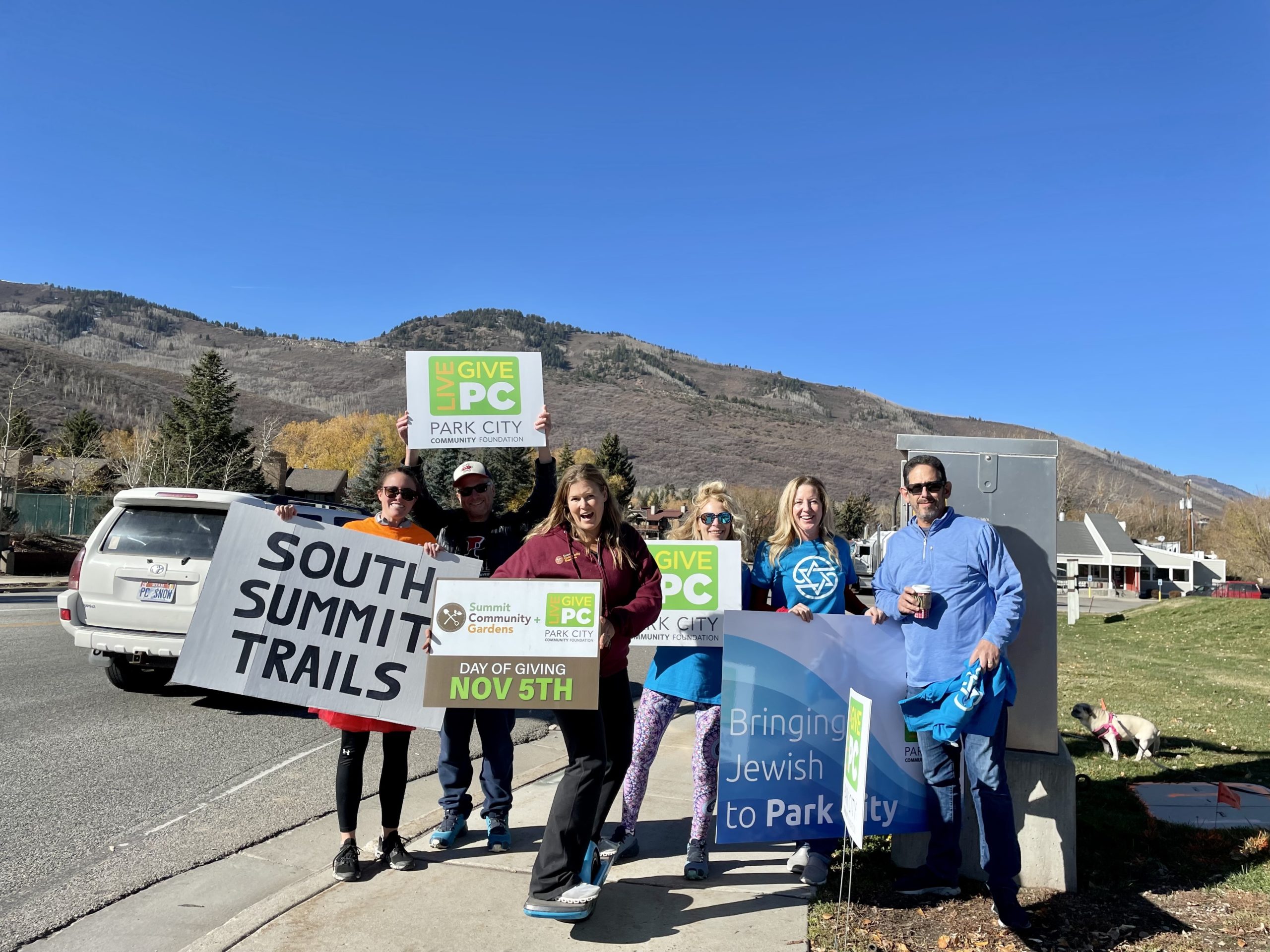 Members of South Summit Trails, Summit Community Gardens, and the United Jewish Federation at the intersection of Kearns and SR 224.
