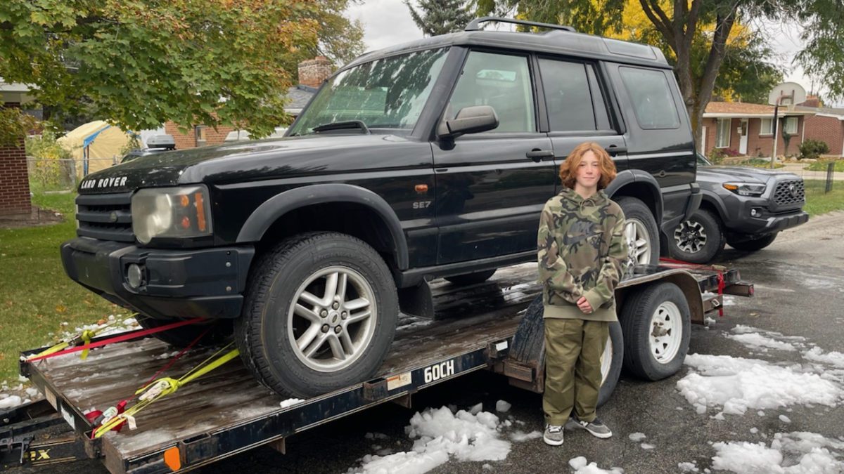 Tommy Brown, with the Land Rover he was able to purchase with the funds from his business last year. His parents matched his contribution.