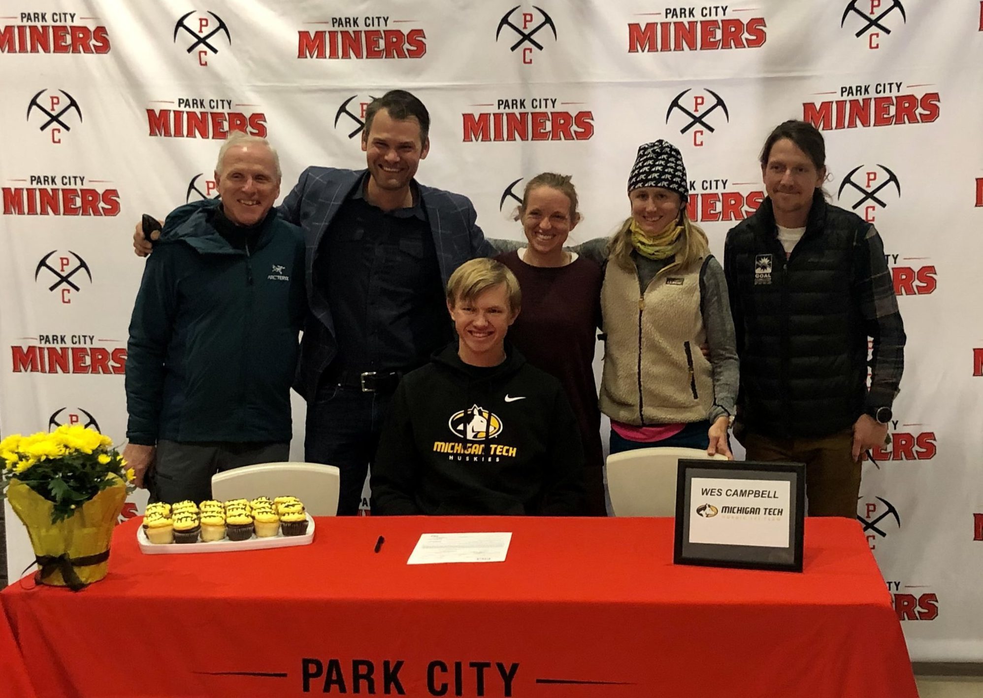 Wes Campbell with his Soldier Hollow Biathlon Team coaches (R to L) Curtis Lupo and Zachary Hall and his Park City Ski and Snowboard Nordic Team coaches Liz Stephen, Emma Garrard, and Alex Docta.