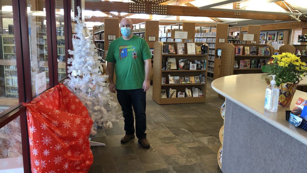 The Summit County Library's Angel Tree with Director Dan Compton wearing what else but a "Goodnight Moon" t-shirt.